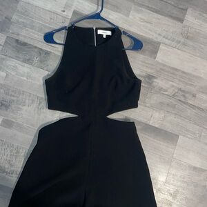 Black romper with side cutouts